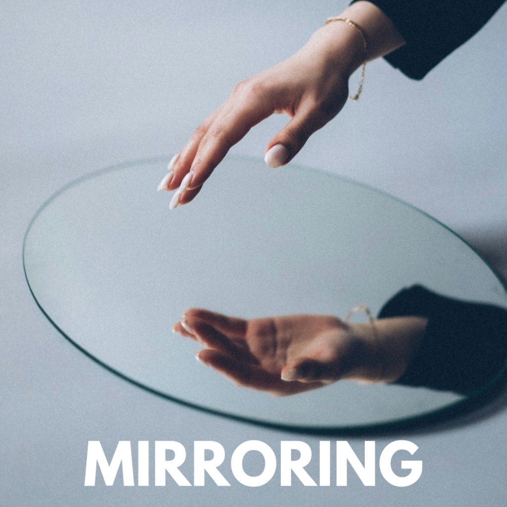 Person standing in front of a mirror with multiple reflections symbolizing perception, energy mirroring, and conscious manifestation in the quantum field
